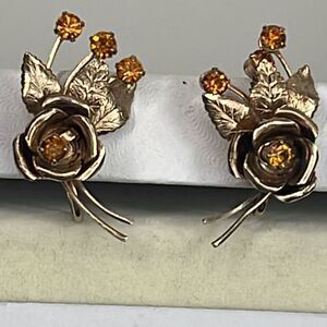 Vintage flower sprays climber earrings. Gold plated amber glass.